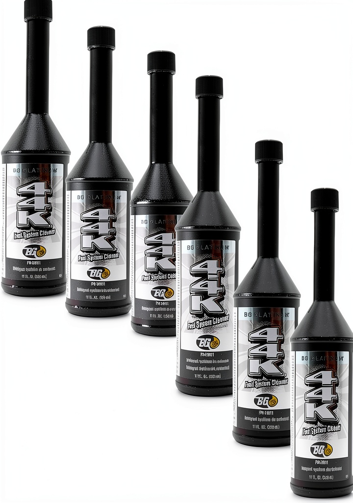 Motor God fuel system cleaner bottles beside a car engine